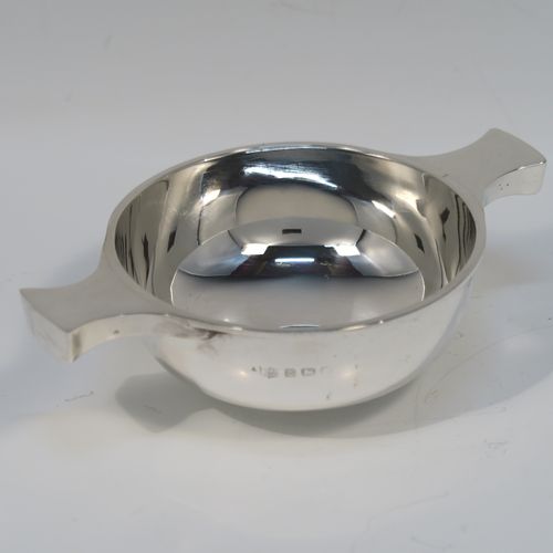 An elegant Sterling Silver Quaich, having a very plain round body, with two side handles, and sitting on a collet foot. This handsome silver Quaich was made by S. Blanckensee of Birmingham in 1933. The dimensions of this fine hand-made silver quaich are diameter of body 9 cms (3.5 inches), height 4 cms (1.5 inches), and it weighs approx. 100g (3.2 troy ounces).   