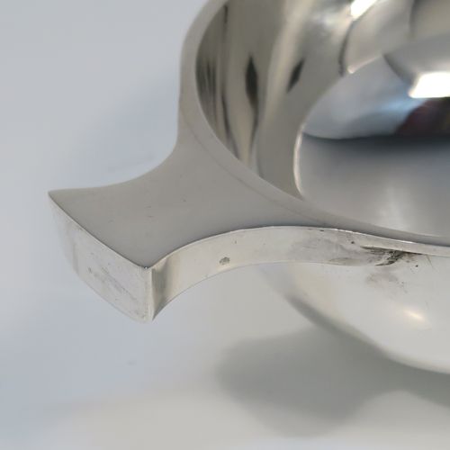 An elegant Sterling Silver Quaich, having a very plain round body, with two side handles, and sitting on a collet foot. This handsome silver Quaich was made by S. Blanckensee of Birmingham in 1933. The dimensions of this fine hand-made silver quaich are diameter of body 9 cms (3.5 inches), height 4 cms (1.5 inches), and it weighs approx. 100g (3.2 troy ounces).   