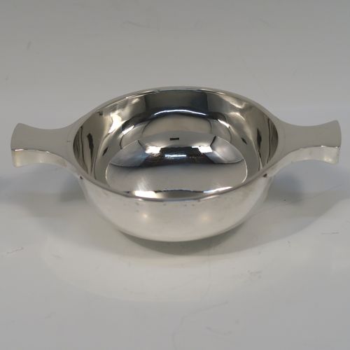 An elegant Sterling Silver Quaich, having a very plain round body, with two side handles, and sitting on a collet foot. This handsome silver Quaich was made by S. Blanckensee of Birmingham in 1933. The dimensions of this fine hand-made silver quaich are diameter of body 9 cms (3.5 inches), height 4 cms (1.5 inches), and it weighs approx. 100g (3.2 troy ounces).   