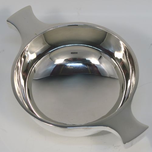 An elegant Sterling Silver Quaich, having a very plain round body, with two side handles, and sitting on a collet foot. This handsome silver Quaich was made by S. Blanckensee of Birmingham in 1933. The dimensions of this fine hand-made silver quaich are diameter of body 9 cms (3.5 inches), height 4 cms (1.5 inches), and it weighs approx. 100g (3.2 troy ounces).   