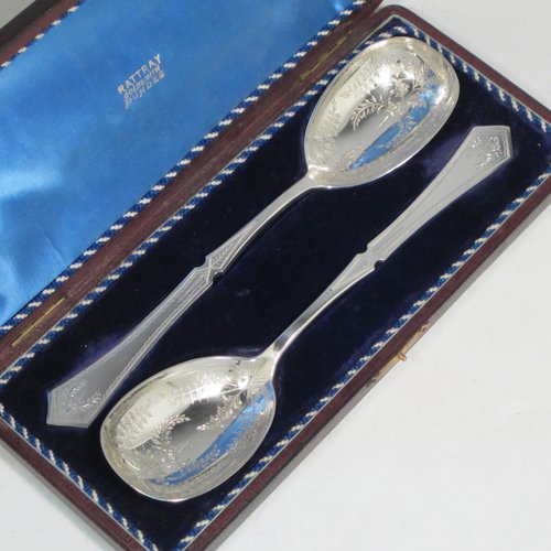 Antique Victorian silver-plated pair of salad servers, having oval bowls and geometrically shaped handled, and featuring hand-engraved floral decoration, all in their original blue satin and velvet-lined presentation box. Made by Francis Higgins in ca. 1880. The length of these fine hand-made silver salad servers are 24 cms (9.5 inches).   