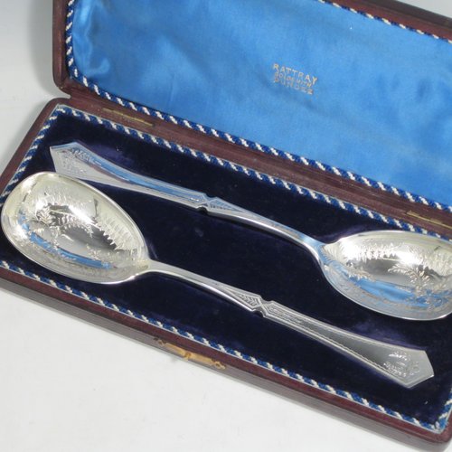 Antique Victorian silver-plated pair of salad servers, having oval bowls and geometrically shaped handled, and featuring hand-engraved floral decoration, all in their original blue satin and velvet-lined presentation box. Made by Francis Higgins in ca. 1880. The length of these fine hand-made silver salad servers are 24 cms (9.5 inches).   