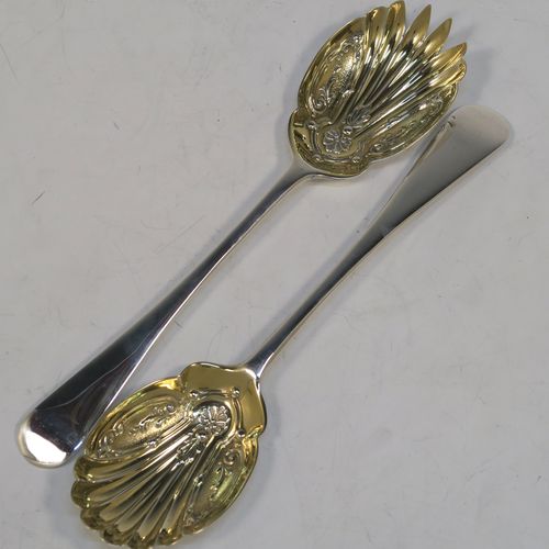 A very pretty pair of Antique Edwardian Sterling Silver salad servers, having plain Old English pattern handles, with hand-chased scalloped and gold-gilt bowls. This beautiful antique silver pair of salad serving spoons was made by Marple and Co., of Sheffield in 1902. The dimensions of these hand-made silver salad servers are length 21.5 cms (8.5 inches), and they weigh a total of 125g (4 troy ounces.   
