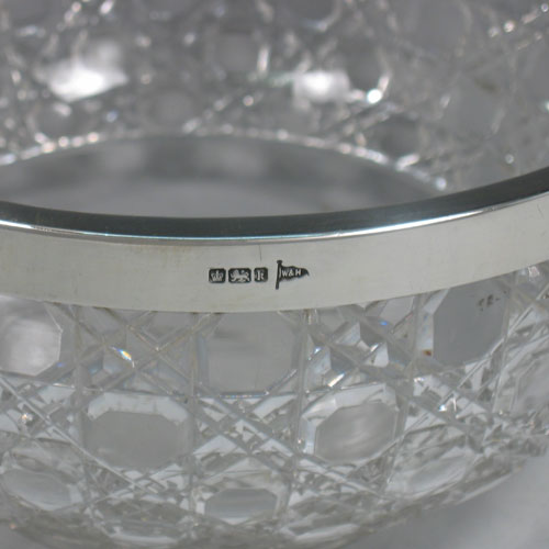 Antique Edwardian sterling silver and hand-cut crystal salad bowl made by Walker & Hall of Sheffield in 1902. Diameter 23 cms.