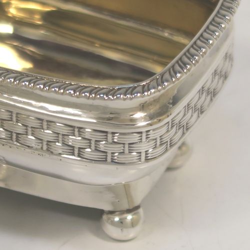 A very unusual and elegant pair of Antique Georgian Regency Sterling Silver salt cellars, having rectangular bellied bodies with rounded corners, decorated with gadroon top borders and central applied bands of basket-weave, with gold-gilt interiors and sitting on four ball feet. These beautiful antique silver salt cellars were hallmarked for London in 1809. The dimensions of these fine hand-made antique silver salt cellars are length 8 cms (3 inches), width 6 cms (2.3 inches), height 4.5 cms (1.75 inches), and they weigh a total of approx. 183g (5.9 troy ounces).