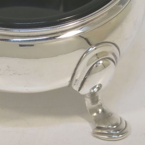 A very handsome Antique Georgian Sterling Silver pair of George II cauldron salt cellars, having plain round bodies, with reeded borders, blue glass liners, and sitting on three cast hoof feet. These elegant antique silver cauldron salt cellars were made by Edward Wood of London in 1746. The dimensions of these fine hand-made silver salt cellars are diameter 6 cms (2.3 inches), height 3 cms (1.25 inches), and they weigh a total of approx. 94g (2 troy ounces).