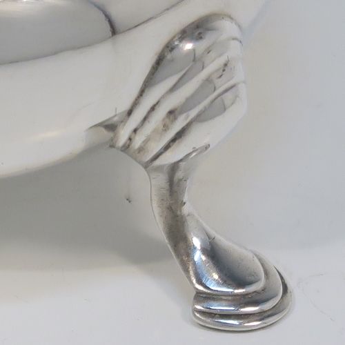 A very handsome pair of Antique Victorian Sterling Silver salt cellars, having plain round bellied bodies, with blue-glass liners, applied shaped gadroon borders, and all sitting on three cast hoof feet with reeded shoulders. These elegant silver salt cellars were made by Francis Boone Thomas of London in 1874. The dimensions of these fine hand-made antique silver salt cellars are diameter 6.5 cms (2.5 inches), height 4 cms (1.5 inches), and they weigh a total of approx. 128g (4 troy ounces).