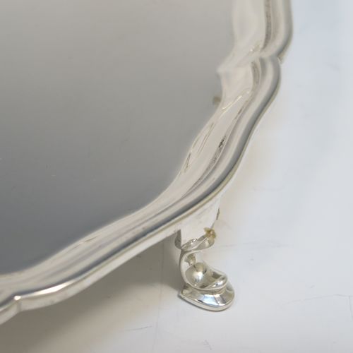 A very handsome Sterling Silver salver, having an applied shaped and reeded Bath border, a plain ground, and sitting on four cast hoof feet. This elegant and large silver salver was made by Charles Boytons and Sons of Sheffield in 1932. The dimensions of this fine hand-made silver salver are diameter 36 cms (14 inches), and it weighs approx. 1,270g (41 troy ounces).