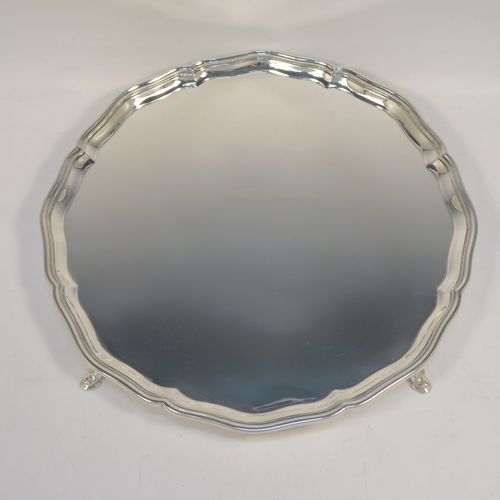 A very handsome Sterling Silver salver, having an applied shaped and reeded Bath border, a plain ground, and sitting on four cast hoof feet. This elegant and large silver salver was made by Charles Boytons and Sons of Sheffield in 1932. The dimensions of this fine hand-made silver salver are diameter 36 cms (14 inches), and it weighs approx. 1,270g (41 troy ounces).