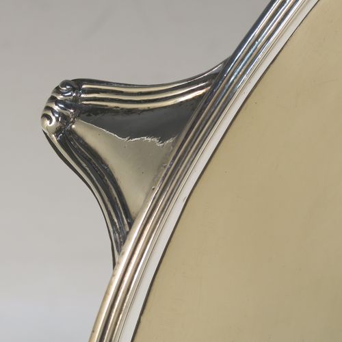 A very handsome Antique Georgian Sterling Silver salver, having an applied reeded border, a plain ground, and sitting on four cast reeded feet. This beautiful antique silver salver was made by John Hutson of London in 1792. The dimensions of this fine hand-made antique silver salver are diameter 35.5 cms (14 inches), and it weighs approx. 1,214g (39 troy ounces).