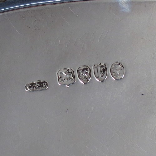 A very pretty Antique Victorian Sterling Silver large salver, having an applied double bead-edged border, with a ground having hand-engraved ferns and song-bird decoration surrounding a central vacant round cartouche, and all sitting on four cast claw and ball feet. Made by Johnson, Walker, and Tolhurst of London in 1881. The dimensions of this fine hand-made antique silver salver are diameter 38 cms (15 inches), and it weighs approx. 1,615g (52 troy ounces).