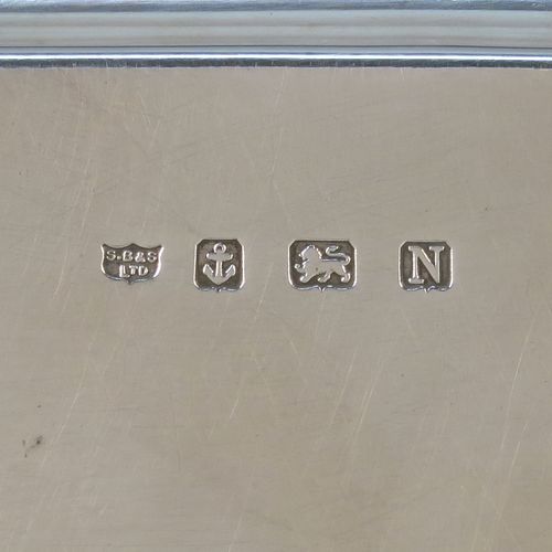 A very elegant Sterling Silver salver, having a square body with shaped and cut corners, a plain burnished ground, an applied reeded border, and sitting on four cast scroll feet. This handsome silver salver was made by S. Blankensee and Sons Ltd., of Birmingham in 1937. The dimensions of this fine hand-made silver salver are 34.5 cms (13.5 inches) square, and it weighs approx. 1,210g (39 troy ounces).