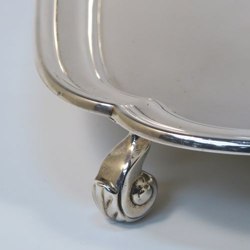 A very elegant Sterling Silver salver, having a square body with shaped and cut corners, a plain burnished ground, an applied reeded border, and sitting on four cast scroll feet. This handsome silver salver was made by S. Blankensee and Sons Ltd., of Birmingham in 1937. The dimensions of this fine hand-made silver salver are 34.5 cms (13.5 inches) square, and it weighs approx. 1,210g (39 troy ounces).