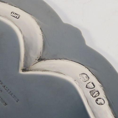 A very pretty Antique Victorian Sterling Silver salver, having an applied and shaped bead-edged border, a hand-engraved ground with floral, scroll, and bird decoration, and sitting on three cast claw and ball feet. This beautiful antique silver salver was made by Stephen Smith of London in 1876. The dimensions of this fine hand-made silver salver are diameter 27.5 cms (10.75 inches), and it weighs approx. 792g (25.5 troy ounces).