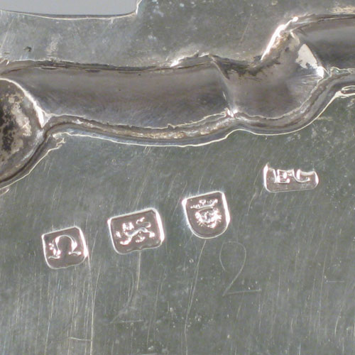 Antique Georgian sterling silver salver, having a shell and scroll border, a plain ground, and sitting on three cast hoof feet. Made by Ebenezer Coker of London in 1768. The dimensions of this fine hand-made silver salver are diameter 29 cms (11.5 inches), and it weighs approx. 688g (22 troy ounces).