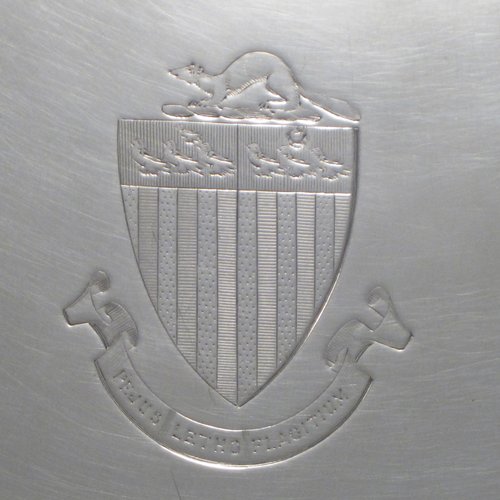 Antique Georgian sterling silver salver, having a shaped gadroon border, a plain ground with a centrally engraved armorial crest, and sitting on three cast hoof feet. Made by Richard Rugg of London in 1770. The dimensions of this fine hand-made silver salver are diameter 30 cms (12 inches), and it weighs approx. 784g (25 troy ounces).