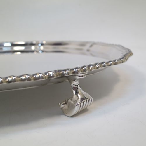 A very handsome Sterling Silver salver, having an applied shaped gadroon border, a plain ground, and sitting on three cast scroll feet. Made by I.S. Greenberg of Birmingham in 1929. The dimensions of this fine hand-made silver salver are diameter 30.5 cms (12 inches), and it weighs approx. 990g (32 troy ounces).