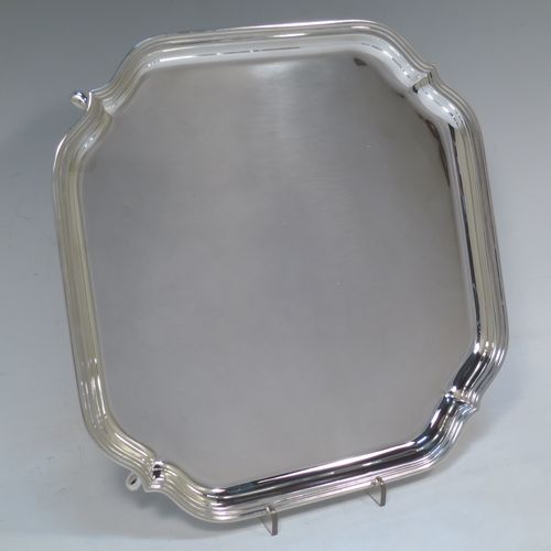 A very handsome Sterling Silver salver, having a square body with shaped and cut corners, a plain burnished ground, an applied reeded border, and sitting on four cast hoof feet. This elegant silver salver was made by Deakin Silversmiths of Sheffield in 1940. The dimensions of this fine hand-made silver salver are 26 cms (10.25 inches) square, and it weighs approx. 625g (20 troy ounces).

   