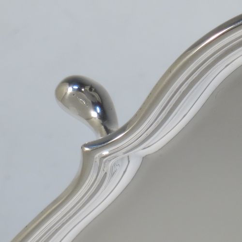A very handsome Sterling Silver salver, having a square body with shaped and cut corners, a plain burnished ground, an applied reeded border, and sitting on four cast hoof feet. This elegant silver salver was made by Deakin Silversmiths of Sheffield in 1940. The dimensions of this fine hand-made silver salver are 26 cms (10.25 inches) square, and it weighs approx. 625g (20 troy ounces).

   