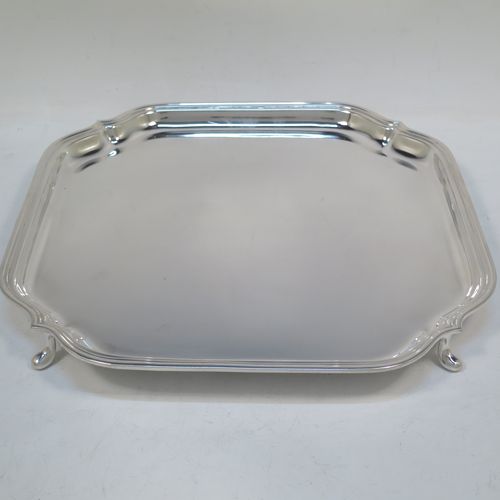 A very handsome Sterling Silver salver, having a square body with shaped and cut corners, a plain burnished ground, an applied reeded border, and sitting on four cast hoof feet. This elegant silver salver was made by Deakin Silversmiths of Sheffield in 1940. The dimensions of this fine hand-made silver salver are 26 cms (10.25 inches) square, and it weighs approx. 625g (20 troy ounces).

   