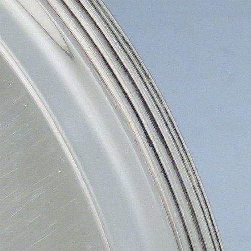 An Antique Georgian Sterling Silver very elegant George III round salver, having a plain ground, an applied reeded border, and sitting on three cast flange feet. Made by Thomas Hannam & John Crouch II of London in 1799. The dimensions of this fine hand-made antique silver salver are diameter 21 cms (8.25 inches), and it weighs approx. 404g (13 troy ounces).