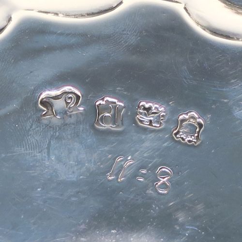 A very elegant pair of Antique Georgian Sterling Silver George II salvers, having plain grounds with applied shaped gadroon and scroll borders, and sitting on three cast hoof feet. These beautiful antique silver salvers were made by John Tuite of London in 1750. The dimensions of these fine hand-made antique Goerge II silver salvers are diameter 17 cms (6.75 inches), and they weigh approx. 475g (15.3 troy ounces).