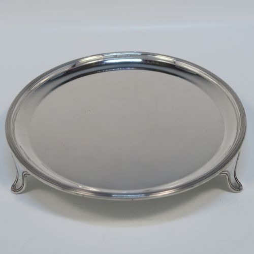 A very elegant and heavy in the hand Sterling Silver round salver, having a plain ground, an applied reeded border, and sitting on three reeded and flanged feet. This handsome silver salver was made by Tessiers of London in 1936. The dimensions of this fine hand-made silver salver are diameter 15 cms (6 inches), and it weighs approx. 224g (7 troy ounces).   