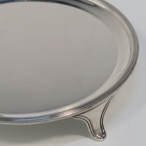 A very elegant and heavy in the hand Sterling Silver round salver, having a plain ground, an applied reeded border, and sitting on three reeded and flanged feet. This handsome silver salver was made by Tessiers of London in 1936. The dimensions of this fine hand-made silver salver are diameter 15 cms (6 inches), and it weighs approx. 224g (7 troy ounces).
