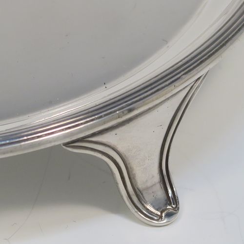 A very elegant and heavy in the hand Sterling Silver round salver, having a plain ground, an applied reeded border, and sitting on three reeded and flanged feet. This handsome silver salver was made by Tessiers of London in 1936. The dimensions of this fine hand-made silver salver are diameter 15 cms (6 inches), and it weighs approx. 224g (7 troy ounces).