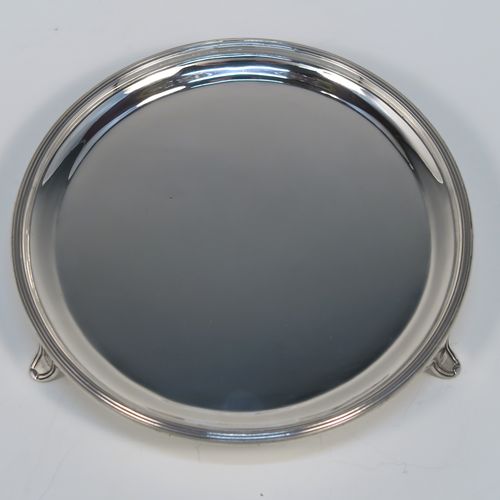 A very elegant and heavy in the hand Sterling Silver round salver, having a plain ground, an applied reeded border, and sitting on three reeded and flanged feet. This handsome silver salver was made by Tessiers of London in 1936. The dimensions of this fine hand-made silver salver are diameter 15 cms (6 inches), and it weighs approx. 224g (7 troy ounces).