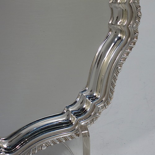 A very handsome Sterling Silver salver, having an applied shaped gadroon border, a plain ground, and sitting on four cast hoof feet. Made by William Bush of Sheffield in 1942. The dimensions of this fine hand-made silver salver are diameter 20 cms (8 inches), and it weighs approx. 375g (12 troy ounces).