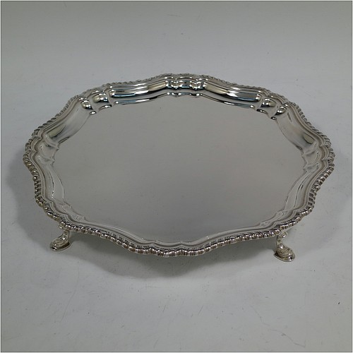 A very handsome Sterling Silver salver, having an applied shaped gadroon border, a plain ground, and sitting on four cast hoof feet. Made by William Bush of Sheffield in 1942. The dimensions of this fine hand-made silver salver are diameter 20 cms (8 inches), and it weighs approx. 375g (12 troy ounces).