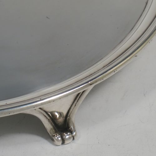 A very handsome Antique Georgian Sterling Silver pair of salvers, having applied reeded borders, plain grounds with hand-engraved central crests, and sitting on three cast reeded flange feet. Made by John Schofiled of London in 1784. The dimensions of these fine hand-made antique silver pair of salvers are diameter 19 cms (7.5 inches), and they weigh a total of approx. 682g (22 troy ounces).