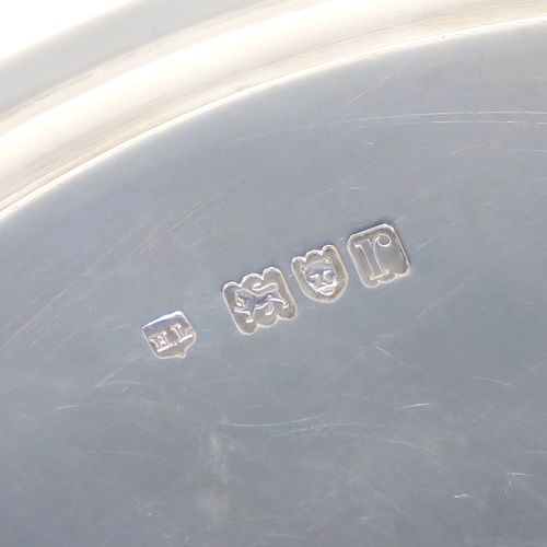 A heavy and very elegant Georgian style Antique Sterling Silver salver, having a plain ground, with an applied reeded border, and all sitting on three cast ball feet. This handsome antique silver salver was made by Herbert Lambert of London in 1912. The dimensions of this fine hand-made silver salver are diameter 23 cms (9 inches), and it weighs approx. 574g (18.5 troy ounces).