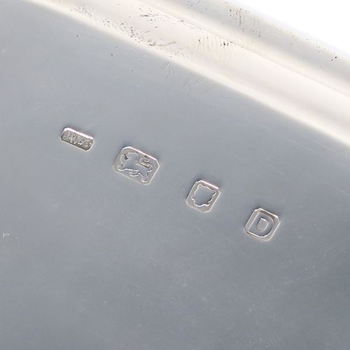 A very handsome Sterling Silver salver, having a square body with an applied cut-corner border, a plain ground, and sitting on four cast scroll feet. This elegant silver salver was made by Josiah Williams and Co., of London in 1939. The dimensions of this fine hand-made silver salver are 19 cms (7.5 inches) square, and it weighs approx. 302g (9.7 troy ounces).