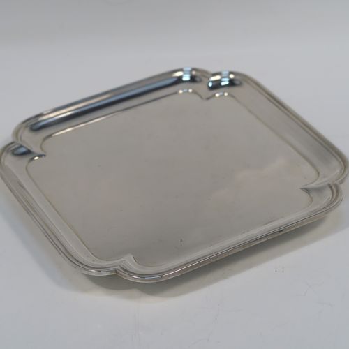A very elegant Antique Edwardian Sterling Silver salver, having a square body with an applied cut-corner and reeded border, a plain ground, and sitting on four flanged feet. This handsome silver salver was made by Thomas Bradbury and Sons of London in 1910. The dimensions of this fine hand-made antique silver salver are 14.5 cms (5.75 inches) square, and it weighs approx. 202g (6.5 troy ounces).   