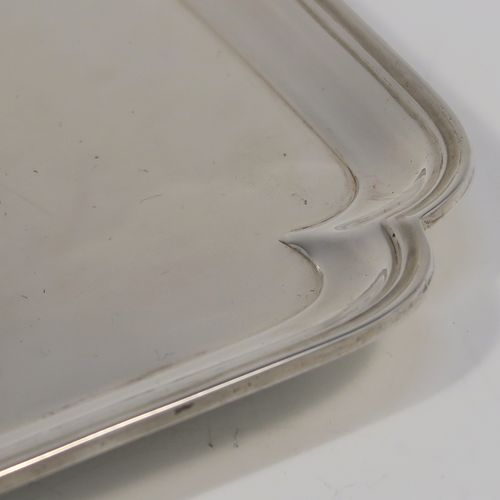 A very elegant Antique Edwardian Sterling Silver salver, having a square body with an applied cut-corner and reeded border, a plain ground, and sitting on four flanged feet. This handsome silver salver was made by Thomas Bradbury and Sons of London in 1910. The dimensions of this fine hand-made antique silver salver are 14.5 cms (5.75 inches) square, and it weighs approx. 202g (6.5 troy ounces).