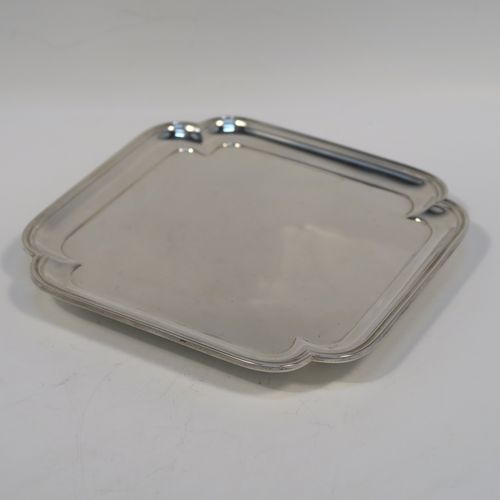A very elegant Antique Edwardian Sterling Silver salver, having a square body with an applied cut-corner and reeded border, a plain ground, and sitting on four flanged feet. This handsome silver salver was made by Thomas Bradbury and Sons of London in 1910. The dimensions of this fine hand-made antique silver salver are 14.5 cms (5.75 inches) square, and it weighs approx. 202g (6.5 troy ounces).