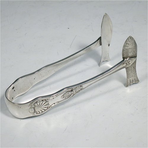 An Antique Victorian Silver Plated and fine China sardine dish, having a rectangular bone China body with hand-painted gold, blue, and orange scroll and floral decoration, all sitting in a plain wire-work galleried frame, a lift-off lid with cast conch shell finial, a plain handle, and all sitting on four wire-work feet, and with a pair of antique silver-plated sardine server tongs in the Kings pattern. The sardine dish made by James Dixon & Sons of Sheffield in ca. 1890. The dimensions of this fine hand-made antique silver-plated and bone China sardine dish are length 14 cms (5.5 inches), width 12 cms (4.75 inches), and height (excluding handles) 7 cms (2.75 inches).