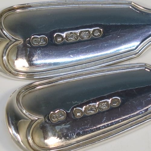 A beautiful Antique Victorian Sterling Silver pair of sauce ladles in the double-struck Fiddle and Thread pattern, having oval bowls. These elegant silver sauce ladles were made by the most important Victorian cutlery maker, George Adams, of London in 1845. The dimensions of this fine pair of hand-made antique silver sauce ladles are length 18.5 cms (7.25 inches), and they weigh a total of approx. 148g (4.8 troy ounces).