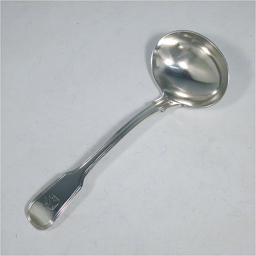 An Antique Georgian Sterling Silver pair of Sauce Ladles in the double-struck Fiddle & Thread pattern. Made by George Piercy of London in 1821. The dimensions of this fine pair of hand-made antique silver sauce ladles are length 17 cms (6.75 inches), and they weigh a total of approx. 140g (4.5 troy ounces). Please note that these items are crested.