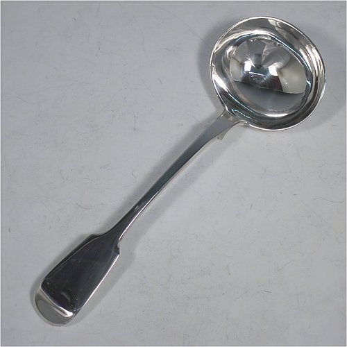 An Antique Victorian Sterling Silver pair of Sauce Ladles in the plain Fiddle pattern with pip on reverse. Made by Charles Lias of London in 1847. The dimensions of this fine pair of hand-made antique silver sauce ladles are length 18.5 cms (7.25 inches), and they weigh a total of approx. 140g (4.5 troy ounces).