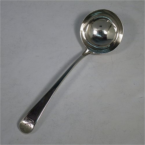 An Antique Georgian Sterling Silver pair of Sauce Ladles in the Old English pattern. Made by George Smith & William Fearn of London in 1790. The dimensions of this fine pair of hand-made antique silver sauce ladles are length 18 cms (7 inches), and they weigh a total of approx. 104g (3.4 troy ounces). Please note that these items are crested.