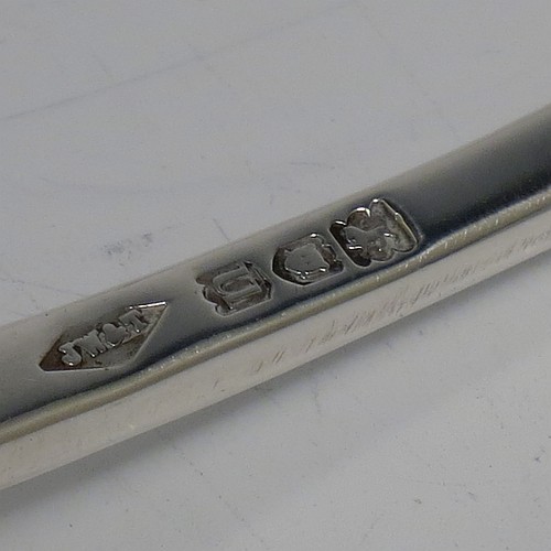 A very handsome Antique Edwardian Sterling Silver pair of Sauce Ladles in the Hollow-Ribbed Rattail pattern, and having round bowls. These elegant antique silver sauce ladles were made by Johnson, Walker, and Tolhurst of London in 1908. The dimensions of this fine pair of hand-made silver sauce ladles are length 18 cms (7 inches), and they weigh a total of approx. 136g (4.4 troy ounces).