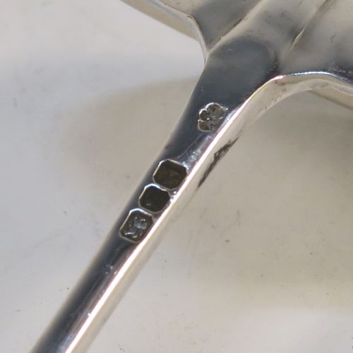 An unusual pair of long-handled Sterling Silver sauce or cream Ladles in the Rattail Hanoverian pattern, having plain round bowls, and long plain handles. This elegant pair of silver ladles were made by Robert Comyns of London in 1975. The dimensions of this fine pair of hand-made silver cream or sauce ladles are length 18 cms (7 inches), and they weigh a total of approx. 98g (3.2 troy ounces).