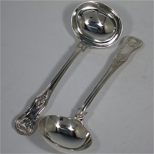 An Antique Georgian Sterling Silver pair of Sauce Ladles in the double-struck Kings pattern. Made by Charles Eley of London in 1825. The dimensions of this fine pair of hand-made Kings Pattern antique silver sauce ladles are length 17 cms (6.75 inches), and they weigh a total of approx. 147g (4.7 troy ounces).