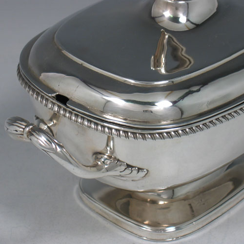Antique Georgian sterling silver sauce tureen and cover, made by Robert Garrard I of London in 1807. Length 21 cms, height 14 cms.