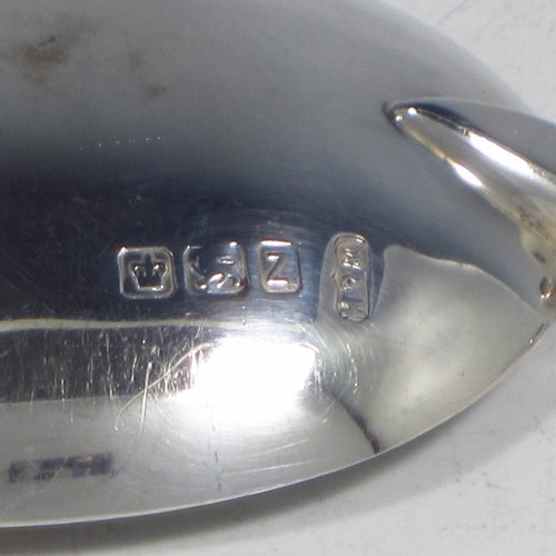 An Antique Victorian Sterling silver set of four serving spoons, having cast handles with figural terminals, and hand-engraved oval bowls with floral decoration, and sitting in a satin and blue velvet-lined presentation box. Made by Walker & Hall of Sheffield in 1892. The dimensions of this fine hand-made set of four silver serving spoons are length 22cms (8.6 inches), and they weigh a total of approx. 333g (10.7 troy ounces).