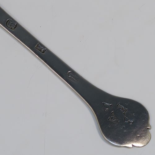 A very handsome Antique James II Sterling Silver Trefid-end table spoon, having a lace-backed rattail pattern bowl, which is slightly worn down on one side (consistent with right-hand usage), together with a trefid terminal having engraved contemporaneous sets of initials on both sides. In original condition with fine patina and colour this elegant James II silver spoon was hallmarked for London in 1688. The dimensions of this fine hand-made antique silver seventeenth century table spoon are length 20cms (8 inches), and it weighs approx. 55g (1.8 troy ounces).