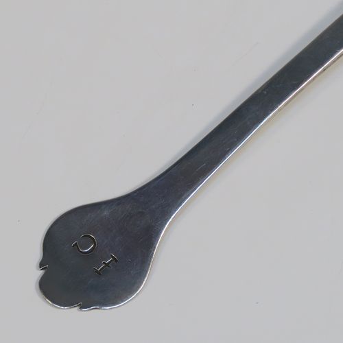 A very handsome Antique James II Sterling Silver Trefid-end table spoon, having a lace-backed rattail pattern bowl, which is slightly worn down on one side (consistent with right-hand usage), together with a trefid terminal having engraved contemporaneous sets of initials on both sides. In original condition with fine patina and colour this elegant James II silver spoon was hallmarked for London in 1688. The dimensions of this fine hand-made antique silver seventeenth century table spoon are length 20cms (8 inches), and it weighs approx. 55g (1.8 troy ounces).